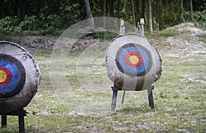 Archery target on the field,light and flare effect added,mean Ã¢â¬Åchoose your goal,targetedÃ¢â¬Â,Ã¢â¬Âsuccess life goalsÃ¢â¬Â photo